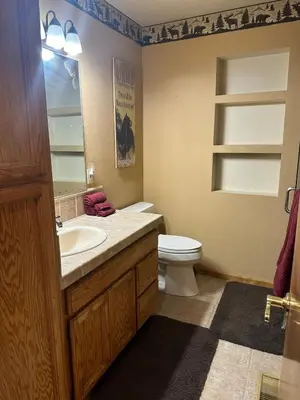 a bathroom with a sink and a toilet in it at Charming Pine Mountain Home with Family Space in Frazier Park