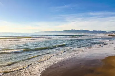 a view of a beach with waves in the ocean at Excellent 1BD Berryman#10 in Los Angeles