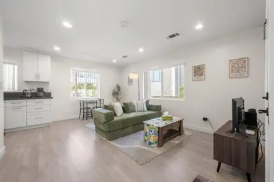 a living room with a couch and a table at Niagara Haven in Burbank