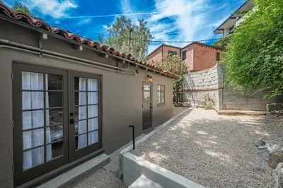 a house with a garage and a driveway at Weho Sunset Strip Hideaway And Casita in Los Angeles