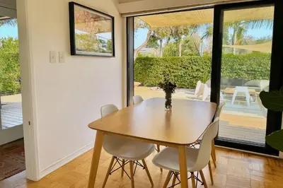 a dining room with a wooden table and chairs at Rad Stay Open Concept House in Mar Vista in Los Angeles