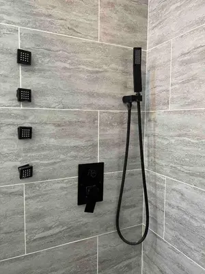 a shower in a bathroom with a black shower at Cute Studio with AC and Backyard in Los Angeles