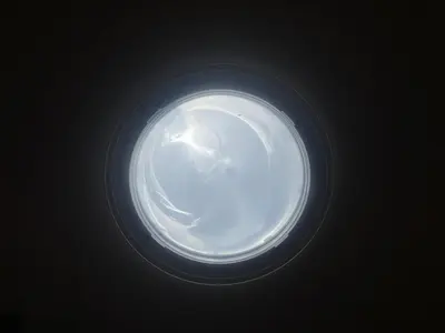 a round light in the ceiling of a building at The Garden Escape in Los Angeles