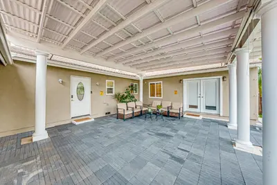 a large room with columns and a table and chairs at Entire 4BR 4BA House in West Covina Modern Private Comfortable in West Covina