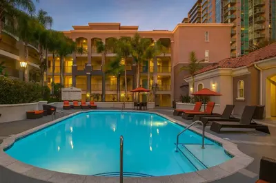a swimming pool with a hotel in the background at Marina Del Rey Sunrise - Pool & Gym & Sauna & Cinema in Marina del Rey