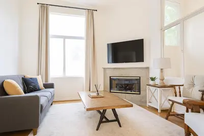 a living room with a couch and a fireplace at Coast Malibu 2BR Escape in Malibu