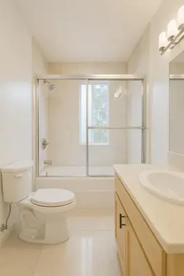 a white bathroom with a toilet and a sink at Coast Malibu 2BR Escape in Malibu