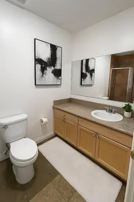 a bathroom with a toilet and a sink at Modern Comfort near Universal in Los Angeles
