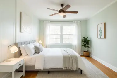 a white bedroom with a bed and a ceiling fan at Fullerton Disneyland Getaway - 4BR in Fullerton