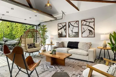 a living room with a couch and a table at Hip Venice Beach Luxury Airstream & Creative Space in Los Angeles