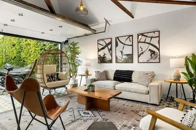 a living room with a couch and a table at Hip Venice Beach Luxury Airstream & Creative Space in Los Angeles