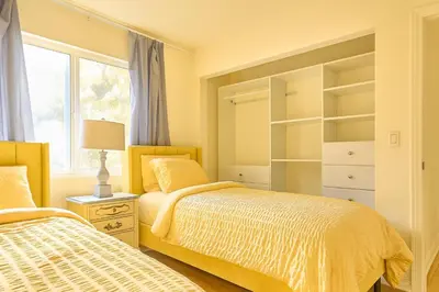 a bedroom with two beds and a window at Malibu Beach - Nature 2BR Retreat in Malibu