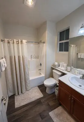 a bathroom with a toilet and a tub and a sink at Chic Marina 1 Bedroom - Pool - Hot Tub - Gym - Sauna in Los Angeles