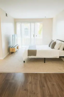 a bedroom with a large bed and a television at Chic Marina 1 Bedroom - Pool - Hot Tub - Gym - Sauna in Los Angeles