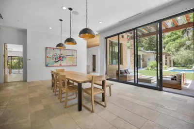 a dining room with a table and chairs at Bowmont in Los Angeles
