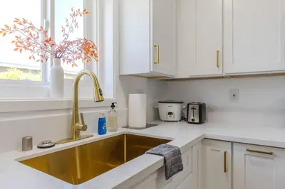 a kitchen with a gold sink in a kitchen at Cozy & Brand New 3BR Home in West Covina in West Covina