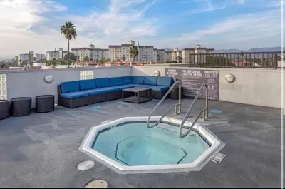 a hot tub on the roof of a building at Cozy and Stylish Unit CC 107 in Los Angeles
