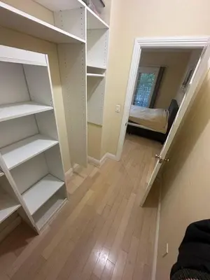 a room with white shelves and a room with a bed at Private room private balcony shared bathroom - Mini Mansion in Burbank