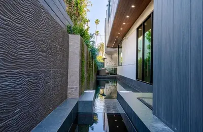 a house with a pool in the middle of a building at Venice House w Pool Spa Home Theater Rooftop in Los Angeles