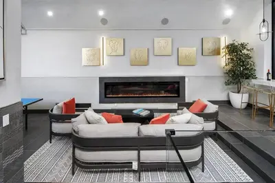 a living room with two couches and a fireplace at Venice House w Pool Spa Home Theater Rooftop in Los Angeles
