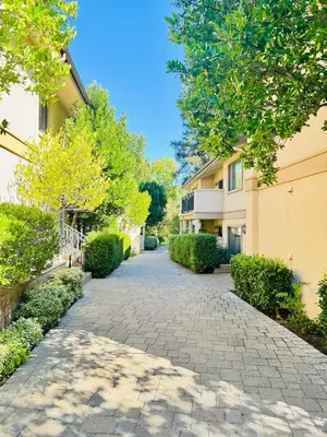 a cobblestone driveway in front of a building at Luxury Pool View Spa Suite-Massage Chair-Steam Sauna-Welcome Champagne ! in Westlake Village