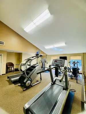 a gym with two tread machines and a treadmill at Luxury Pool View Spa Suite-Massage Chair-Steam Sauna-Welcome Champagne ! in Westlake Village
