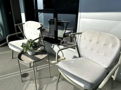 two chairs and a table with a potted plant at Cozy studio in heart of Santa Monica free parking in Los Angeles