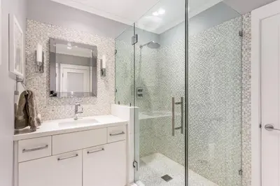 a bathroom with a glass shower and a sink at Sunset Strip 5 Star Location w Pool Jacuzzi Cabana BBQ in Los Angeles