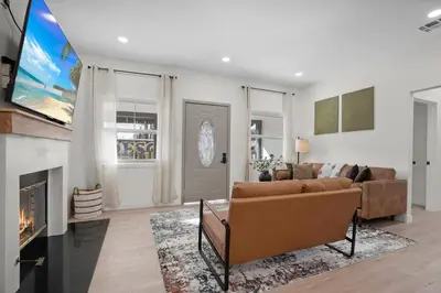 a living room with a couch and a fireplace at Stylish Cozy getaway in West Valley Area Heliport
