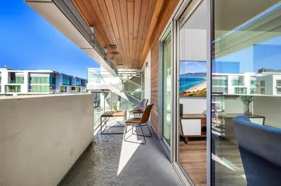 a balcony of a house with a view of the ocean at Luxury by the Beach with Pool, Gym, Game Room in Los Angeles