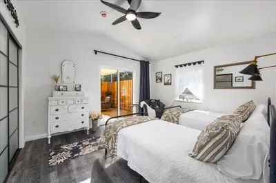 a bedroom with two beds and a ceiling fan at The Petite-Villas at Dorner Family Vineyard in Tehachapi