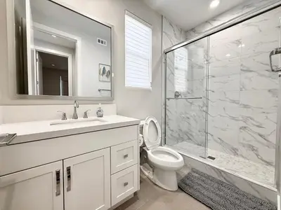 a bathroom with a sink toilet and a shower at #Marbella Lane - Spacious 4BR Modern Family Home! in Placentia