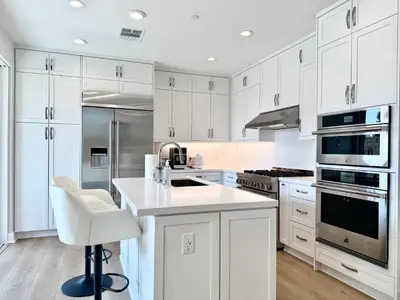 a kitchen with white cabinets and a white counter top at #Marbella Lane - Spacious 4BR Modern Family Home! in Placentia