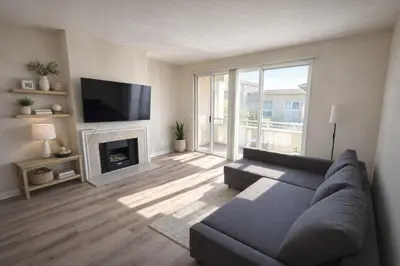 a living room with a couch and a fireplace at Marina Del Rey Beach Retreat w Hot Tub, Billiards & Grill in Los Angeles