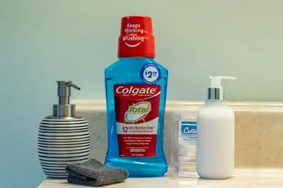 a bottle of toothpaste and a container of cleaner on a sink at 4BR Fullerton Retreat - Private Backyard in Fullerton