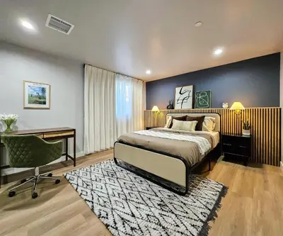 a bedroom with a bed and a desk and a chair at Dondo Stay in Los Angeles