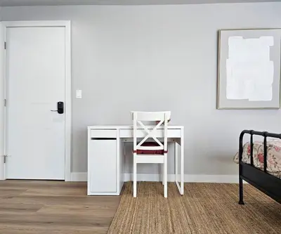 a chair sitting at a desk in a bedroom at Dondo Stay in Los Angeles