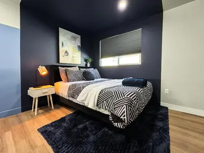 a bedroom with a bed with a zebra print comforter at Dondo Stay in Los Angeles