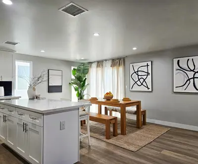 a kitchen with a counter and a table in it at Dondo Stay in Los Angeles