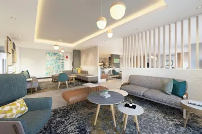 a living room with couches and tables at TownePlace Suites by Marriott Ridgecrest in Ridgecrest