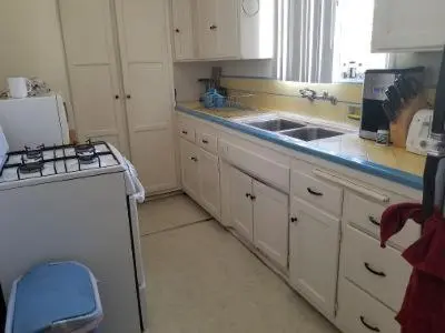 a kitchen with a sink and a stove and a refrigerator at Beautiful apartment close to Cedars! Beverly Hills in Los Angeles