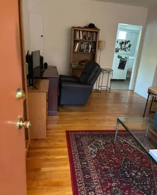 a living room with a couch and a table at Beautiful apartment close to Cedars! Beverly Hills in Los Angeles