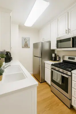 a kitchen with a stainless steel stove and refrigerator at Marina Del Rey Getaway - Resort Amenities in Marina del Rey in Los Angeles