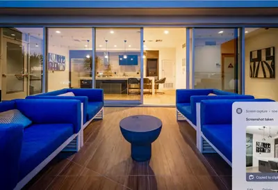 a living room with blue couches and a table at A Class Weho 2BD 2BA with Free Parking in Los Angeles