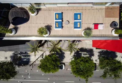 an overhead view of a parking lot with palm trees at A Class Weho 2BD 2BA with Free Parking in Los Angeles