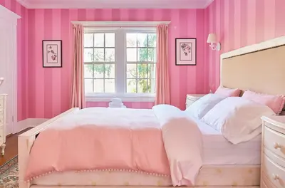a pink bedroom with a bed and a window at Luxe Homestay in Hollywood - by The Grove & Walk of Fame in Los Angeles