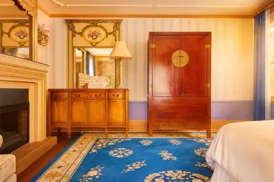 a bedroom with a bed and a door and a mirror at Iconic Hollywood Homestay Near Walk Of Fame in Los Angeles