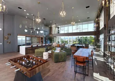 a large room with a table and chairs and a lobby at Pacific Paradise 10 Min from Disneyland With Pool & GYM in Santa Ana