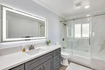 a white bathroom with a sink and a shower at Enchanting 4-bedroom house with panoramic view in Pasadena in Los Angeles