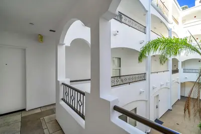 a staircase in a building with white walls and ceilings at Amazing & Spacious in Heart of Santa Monica- Easy Access to ALL Tourist attractions in Los Angeles